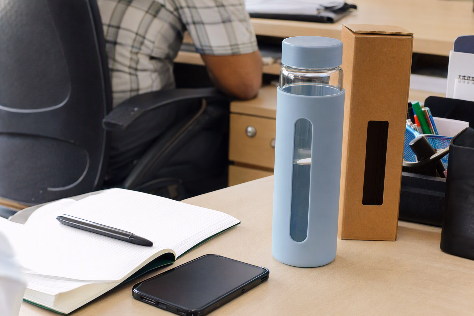 Support desk with bottle, parcel and notebook