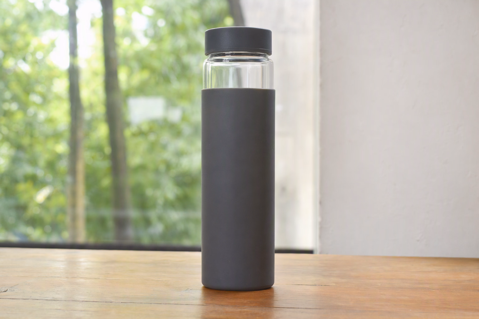 Active 750 tall glass bottle in graphite sleeve